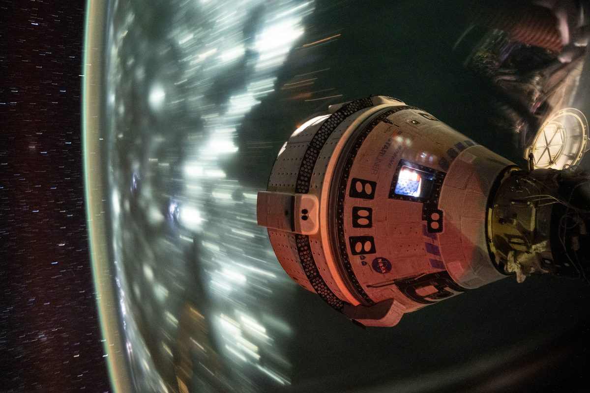 Boeing's Starliner spacecraft that launched NASA's Crew Flight Test astronauts Butch Wilmore and Suni Williams to the International Space Station is pictured docked to the Harmony module's forward port. This long-duration photograph was taken on July 3, 2024, from the orbital complex as it soared 25
