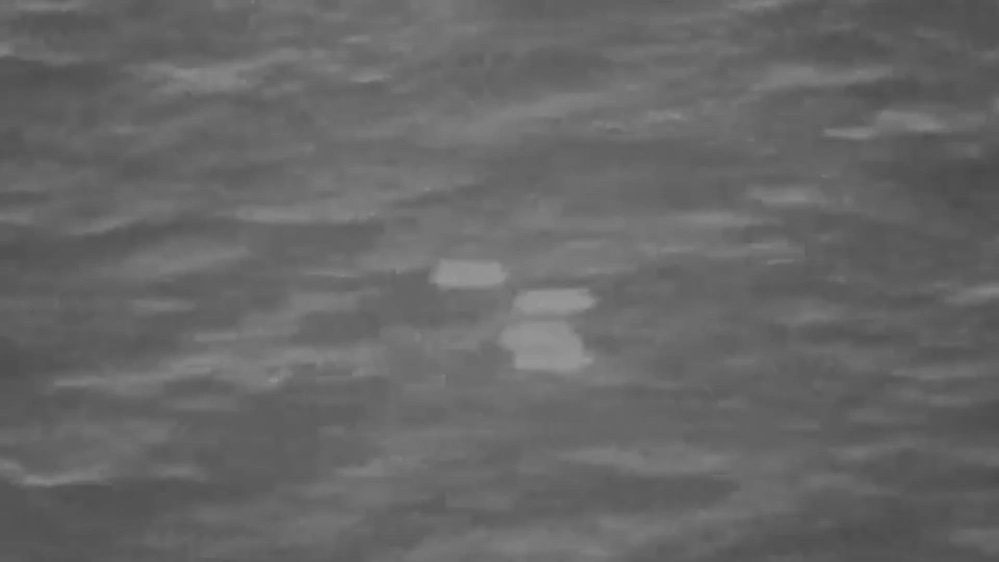 Still frame from the video DOW-UAP-PR052, "UAP USO Formation [CALLSIGN] (Mission)"