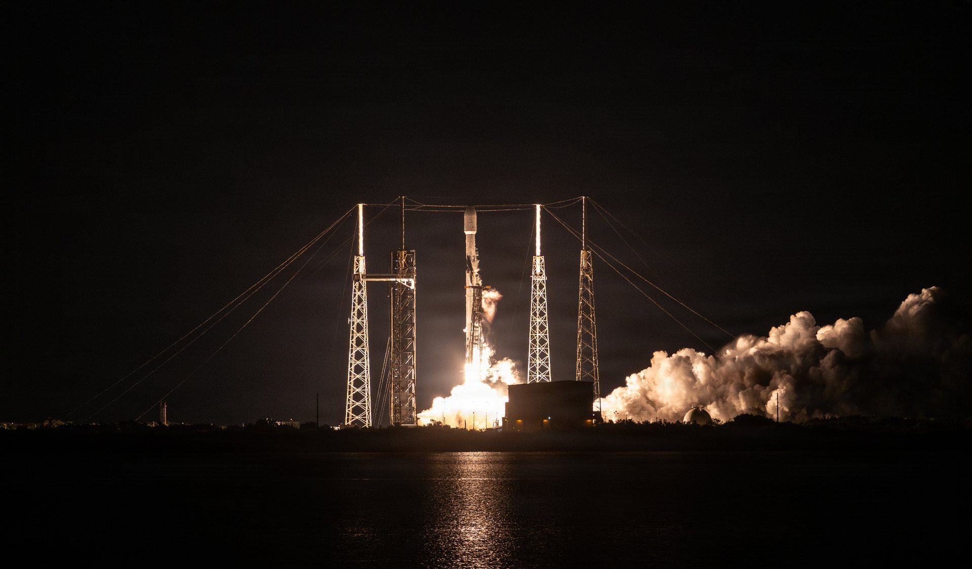 A SpaceX Falcon 9 lifts off at night from Space Launch Complex 40 at Cape Canaveral on November 2, 2025, carrying the Bandwagon-4 rideshare mission with Starcloud-1 aboard. U.S. Space Force photograph.